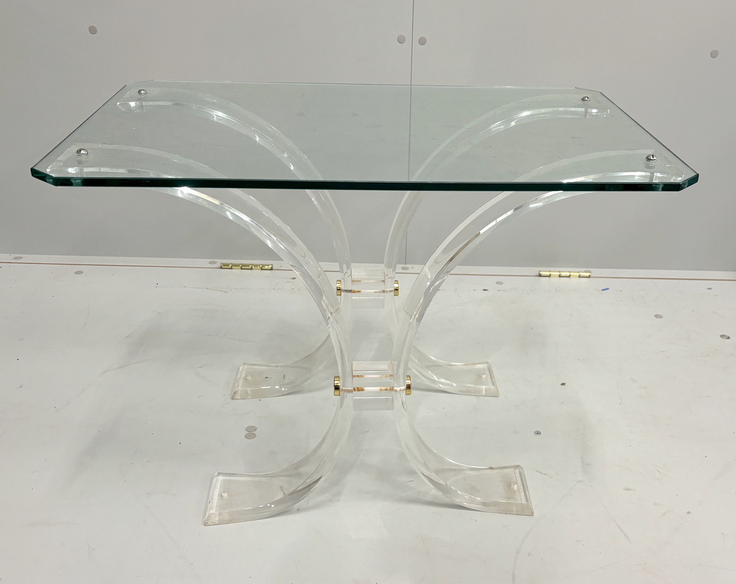 A perspex and glass coffee table, width 69cm, depth 46cm, height 47cm